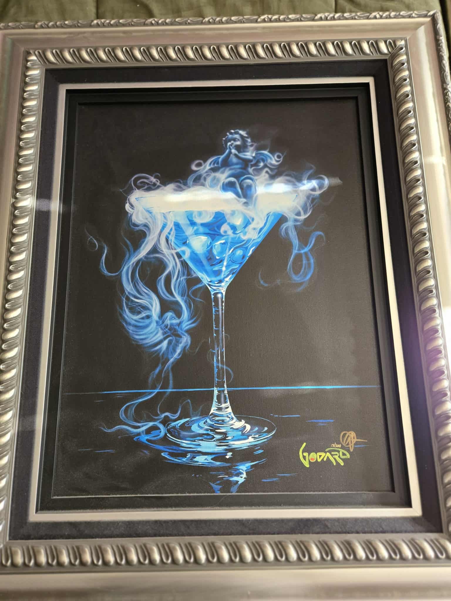 Michael Godard Drink with an Angel: Michael Godard "Drink with an Angel" 2020 23" x 17 1/2" image size Giclee in color with hand-embellishment on canvas. Hand-signed in ink lower right by the artist. Gallery framed, COA, Appraisal. SSR