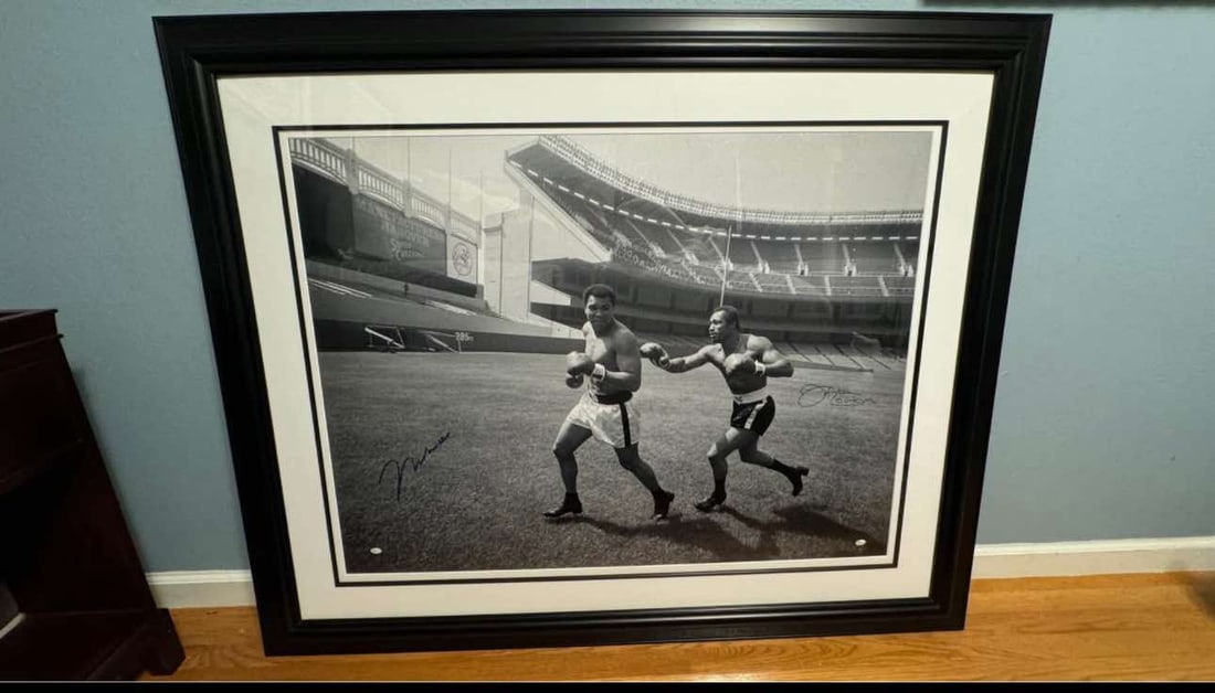Muhammad Ali/ Ken Norton Signed black and white photograph: Sports Memorabilia "Muhammad Ali Ken Norton Signed Black and White Photograph" 30" x 40" Black and White photograph hand-signed by Muhammad Ali and Ken Norton in Blue Ink. Gallery Framed, COA,
