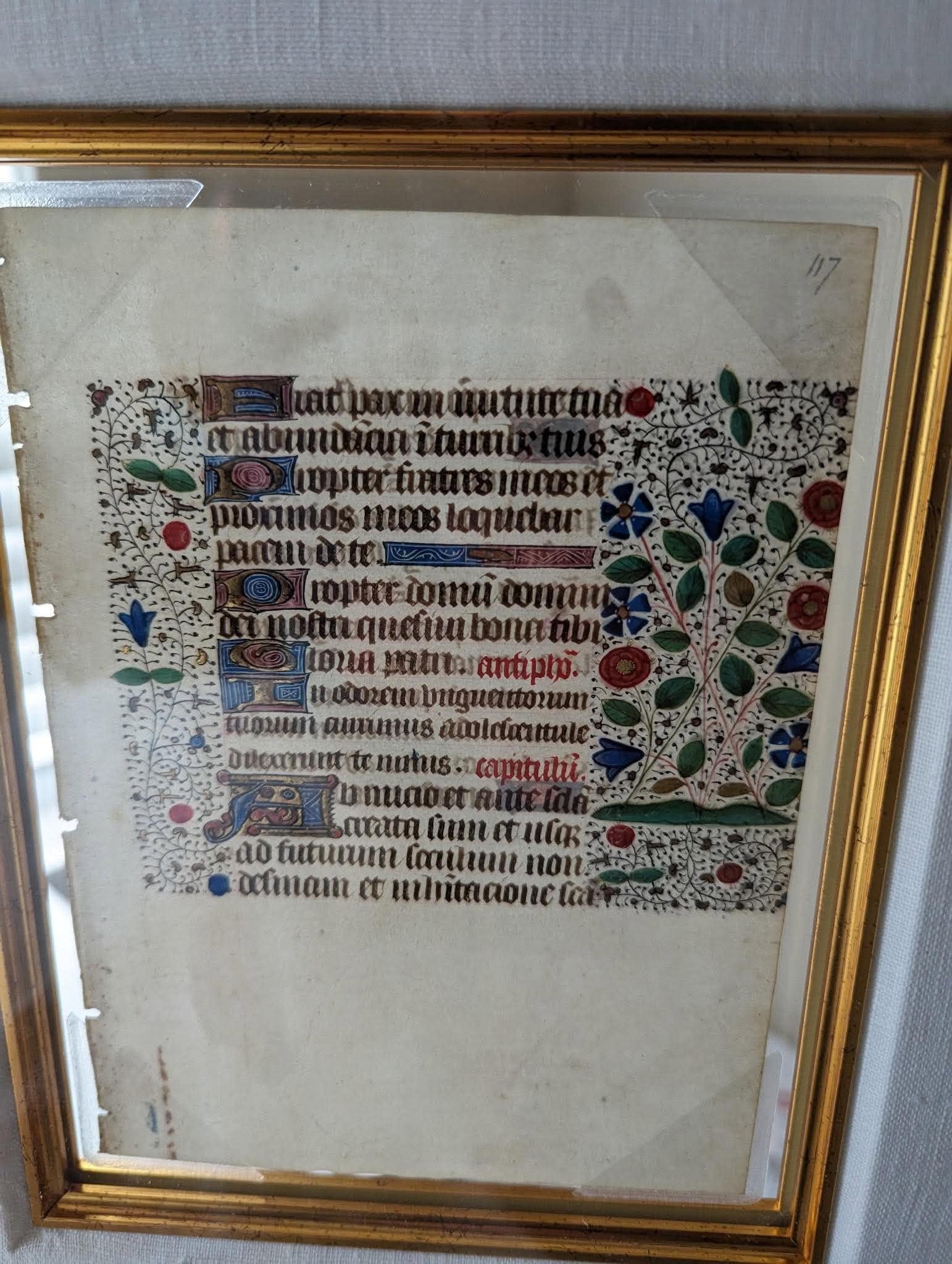 Manuscript Leaf from a Boof of Hours: Manuscript "Leaf from a Book of Hours" c 1480 7 5/16" x 5 3/8" image size (Leaf) A leaf on vellum from a Book of Hours from Rouen, France, Painted on both sides. With side panels with floral design an