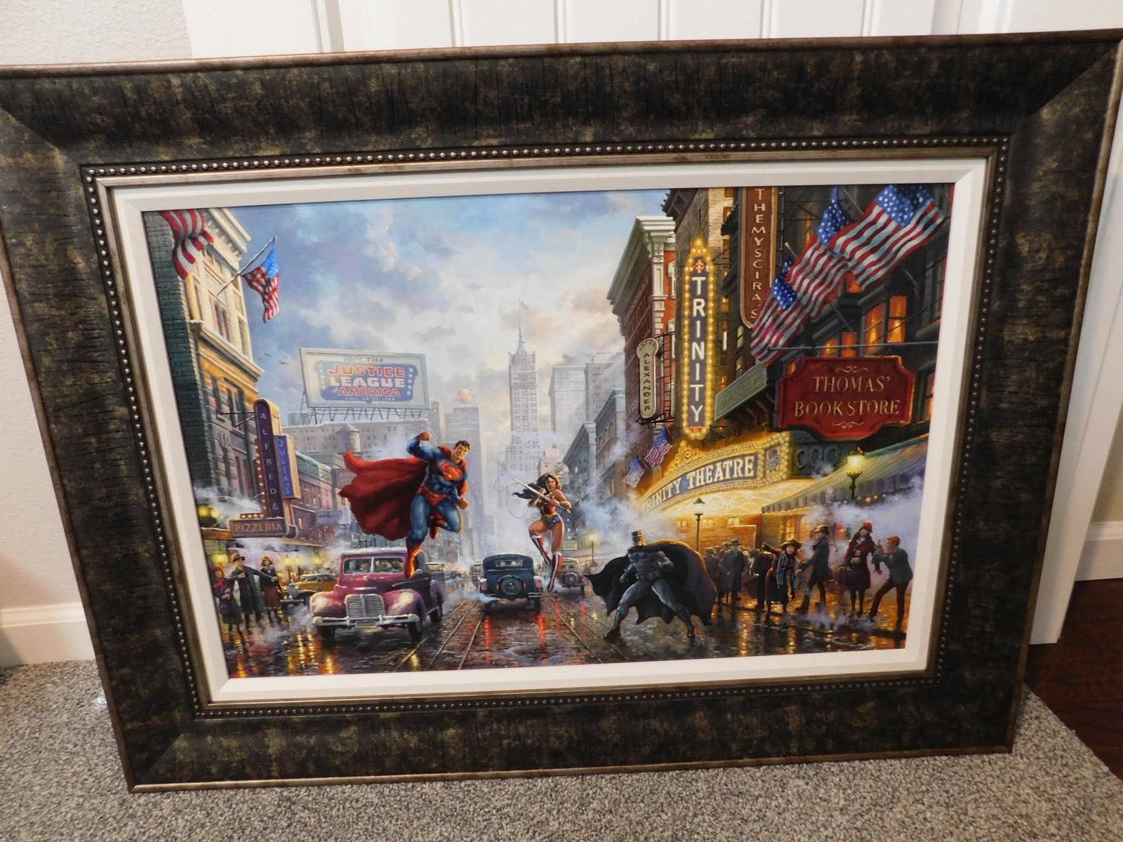 Thomas Kinkade Studios Batman Superman and Wonder Woman - The Trinity: Thomas Kinkade Studios "Batman Superman and Wonder Woman - The Trinity" 2016 18" x 27" image size Giclee in color with acrylic embellishments on canvas. Signed with the artists studios authorized
