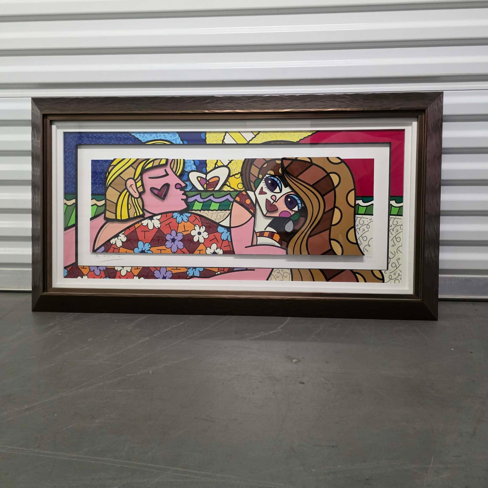 Romero Britto Couple at the Beach: Romero Britto "Couple a the Beach" 2015 16" x 36" image size Three-dimensional serigraphy construction in color with cut-outs in serigraphy. Hand signed in pencil lower left by the artist. Gallery