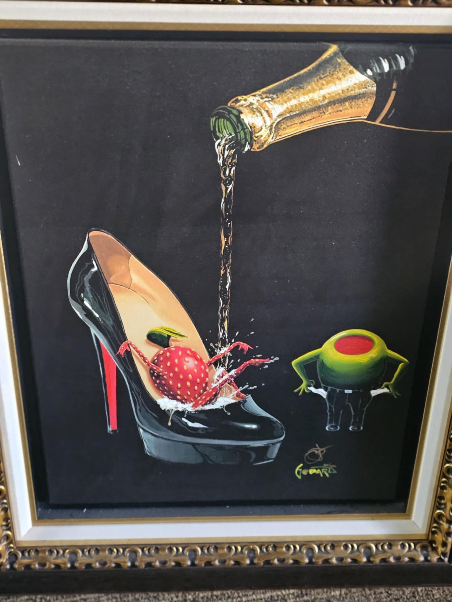 Michael Godard Champagne Shoe Giclee: Michael Godard "Champagne Shoe" 2018 22 1/2" x 17 1/2" image size Giclee in color with hand-embellishment on canvas. Hand-signed in ink lower right by the artist. Gallery framed, COA, Appraisal.