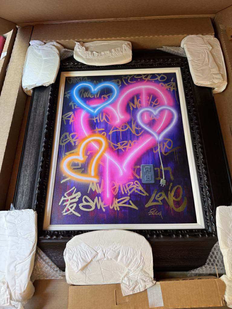 Ziggy Powered by Love: Ziggy "Powered by Love" 2023 24" x 18 1/2" image size Giclee in color with hand-embellishment on canvas. Hand-signed by the artist. Gallery framed, COA, appraisal BA