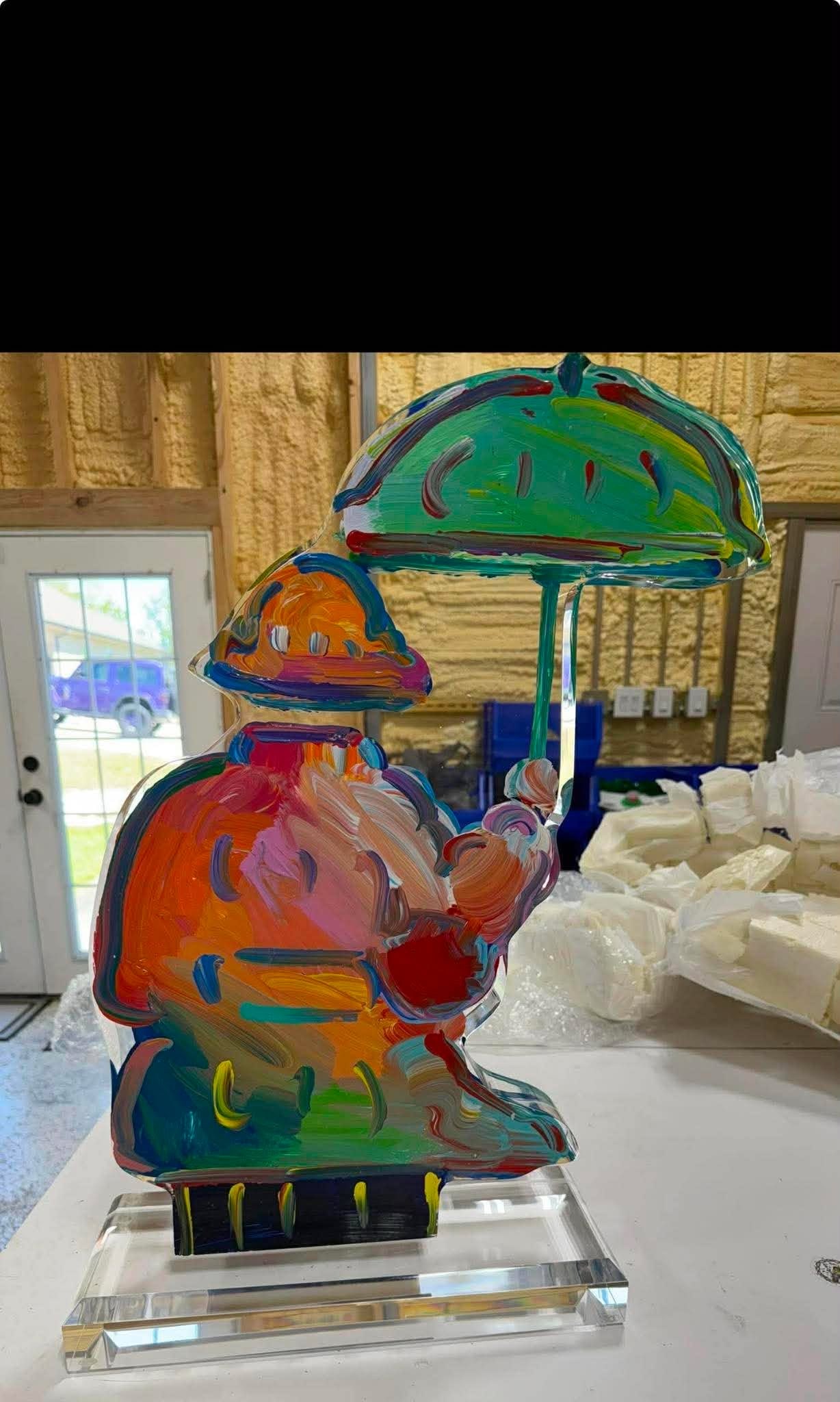 Peter Max Umbrella Man Ver I num 60 sculpture: Peter Max "Umbrella Man Ver. I # 60" 2014 24" x 17" x 2" Acrylic sculpture hand painted in the Peter Max Studio. Hand-signed in pigment lower right by the artist . A unique work. COA, Appraisal. DRD