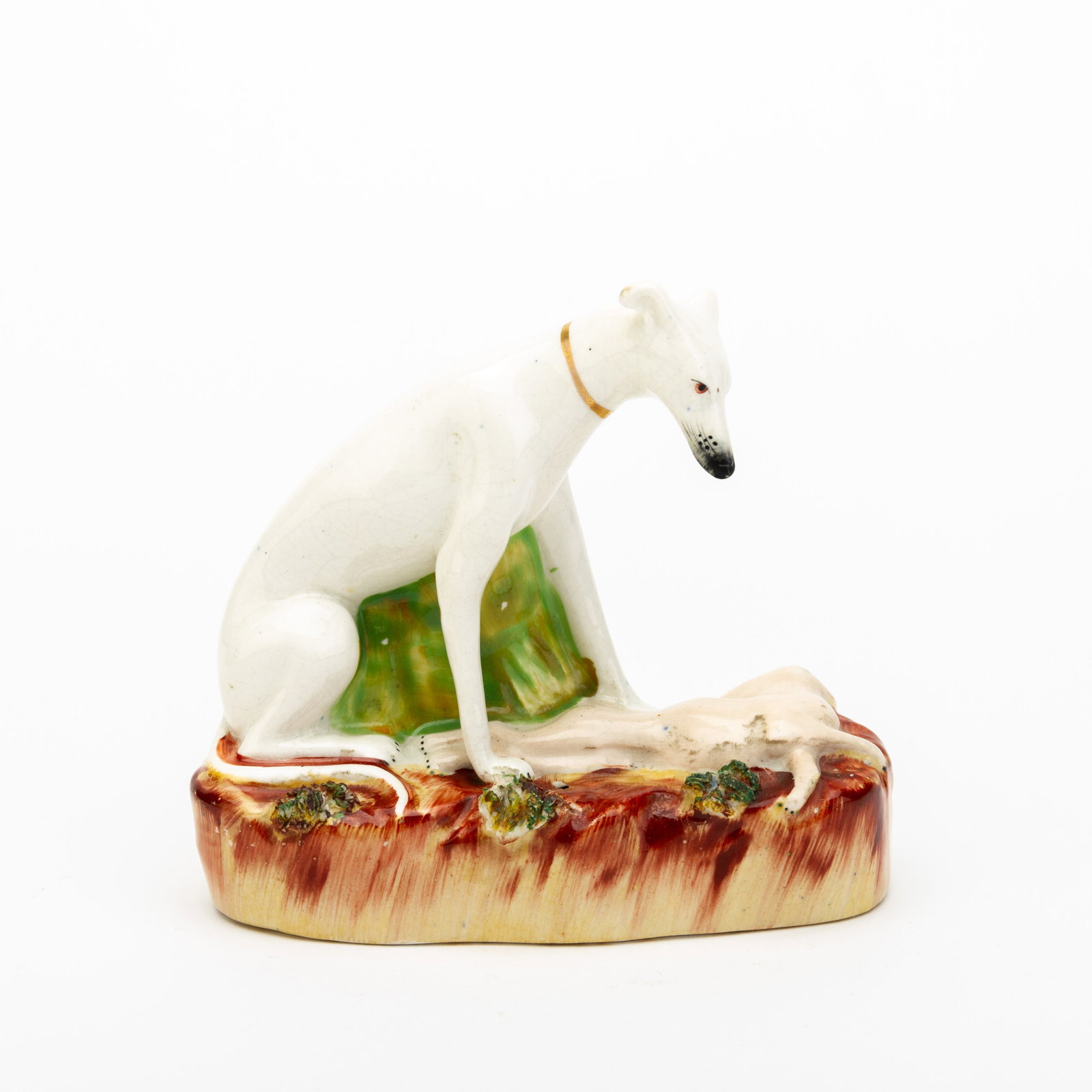 English Staffordshire Pottery Victorian Figure of a Whippet with Prey: DIMENSIONS APPROX 12.5x13x5CM. Potential buyers should note that condition reports are matters of opinion only, they are non-exhaustive and based solely on what can be seen to the naked eye unless oth