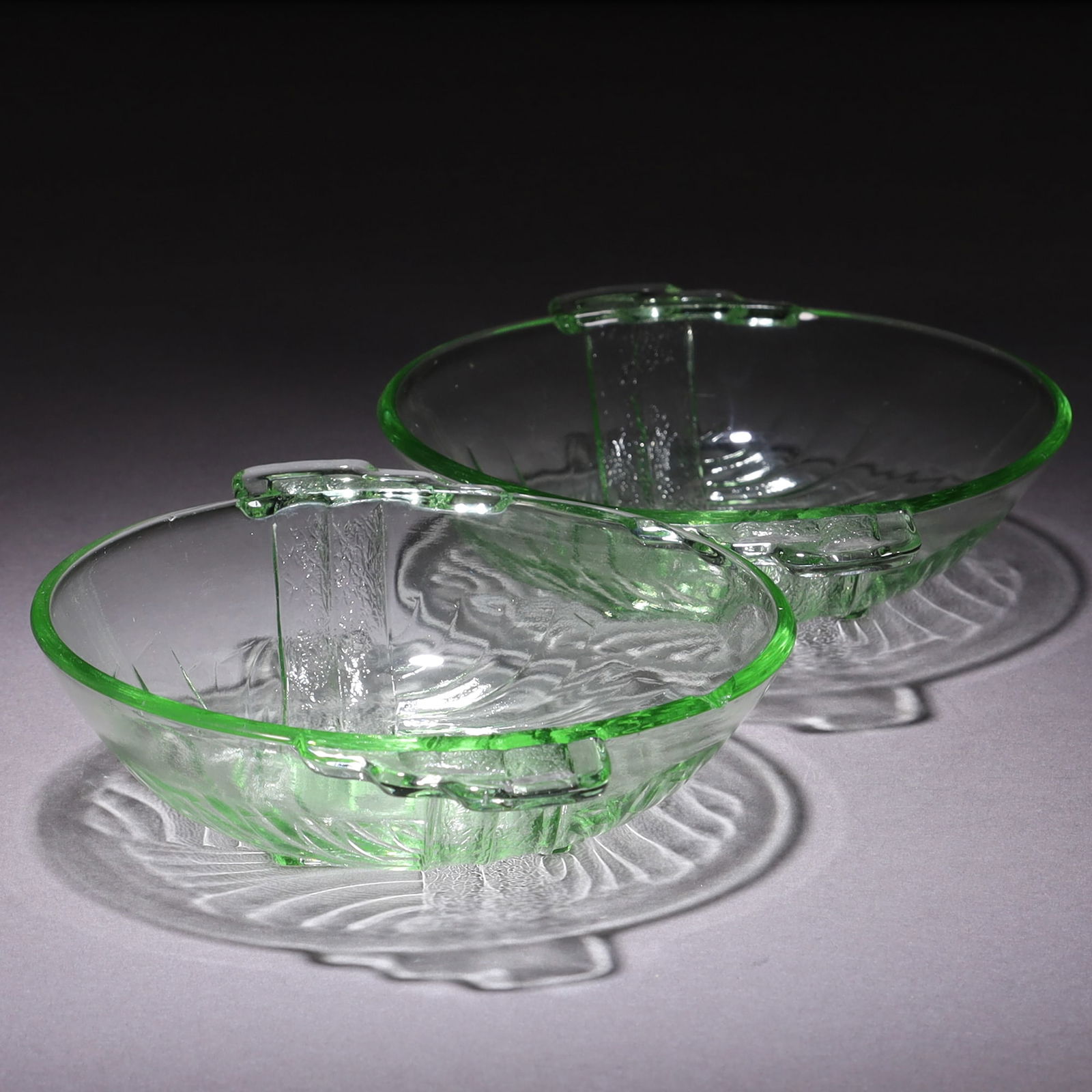 Uranium Glass Pair of Intaglio Art Deco Bowls: MEASURING APPROX 14.5 X 11CM.