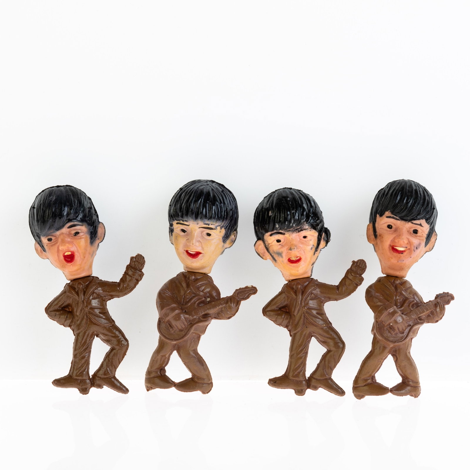 The Beatles Set of Four Plastic Dolls 1960s: DIMENSIONS APPROX 4x5x11CM. Potential buyers should note that condition reports are matters of opinion only, they are non-exhaustive and based solely on what can be seen to the naked eye unless otherw