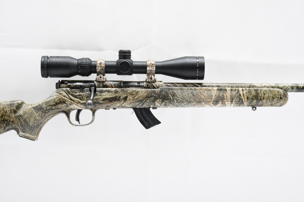 Savage MK-II Synthetic Camo (22"), 22 LR, Bolt-Action, SN - 1163031: SPECS: Synthetic checkered stock with camo pattern & fluted comb, 22" barrel with recessed muzzle crown, AccuTrigger, sling studs, 10-round steel magazine and mounted Hawke Sport HD 3-9x40 scope. COND