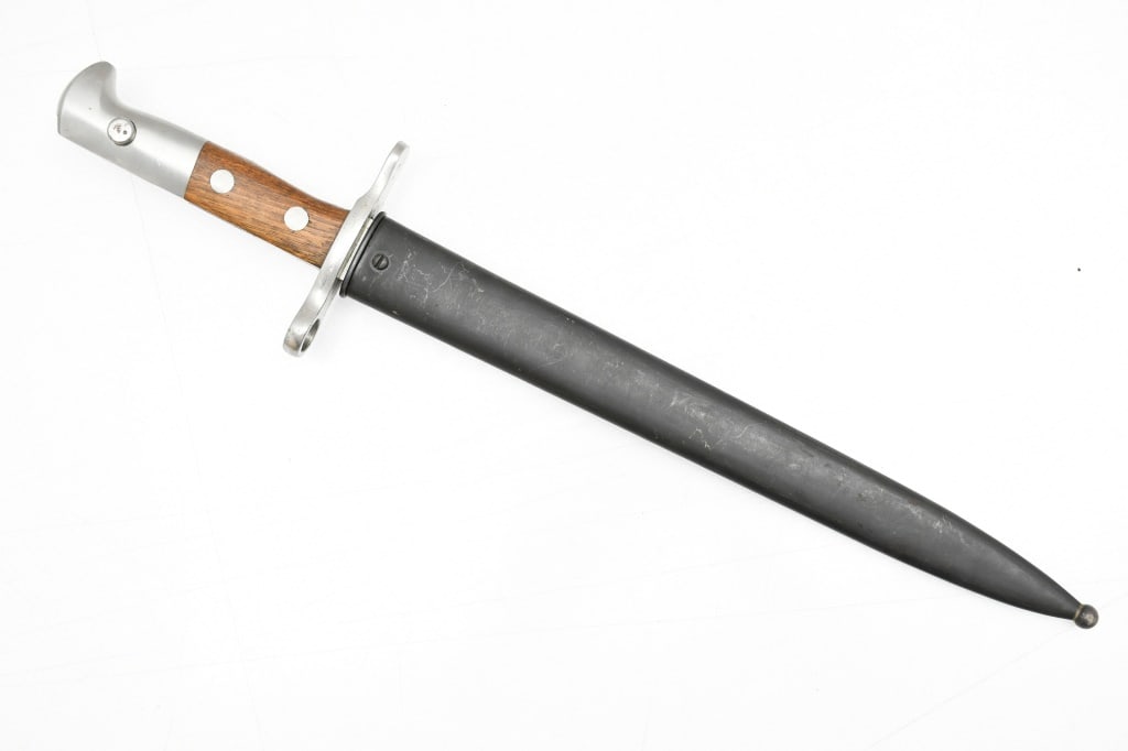 Swiss M1918 Bayonet (11.75" Blade) W/ Scabbard: This knife/bayonet is for use on the 7.5mm Schmidt-Rubin M1911 carbine and M1931 Short Rifle (K31). SPECS: 11.75" Blade, 17" overall length and metal scabbard. MARKINGS: "ELSENER SCHWYZ". ADDITIONAL I