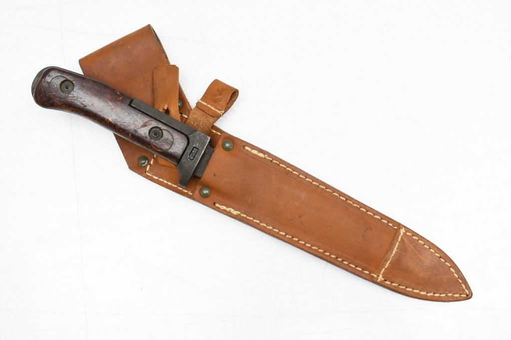 Czech VZ–58 Bayonet (6.8" Blade) W/ Scabbard: This knife/bayonet is for use on the 7.62mm Czechoslovakian vz. 58 assault rifle. SPECS : 6.8" Blade, 11.25" overall length, composition grip (wood bonded with phenol formaldehyde resin), and brown le