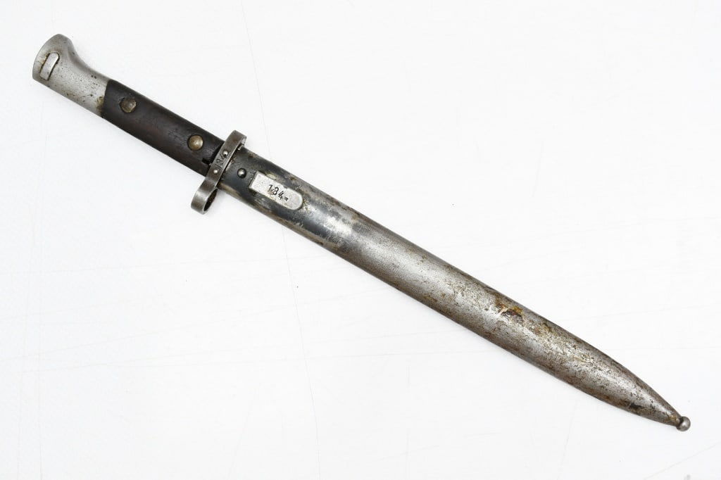 Czech VZ–24 Bayonet (11.75" Blade) W/ Scabbard: This knife/bayonet is for use on the 8mm Mauser vz. 24 and vz. 23 rifles. SPECS: 11.75" Blade, 17" overall length and metal scabbard. BAYONET MARKINGS: "CSZ/ P", "E27" and "134". SCABBARD MARKINGS: "1