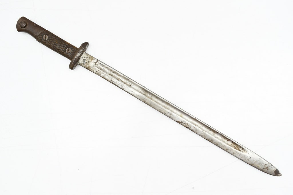 Spanish M1913 Bayonet With Modified Guard (15.5" Blade): This sword/ bayonet was originally for use on the Spanish Mauser M1916 Short Rifle but has had the muzzle ring ground off. SPECS: 15.5" Blade, checkered wood grips, 20.5" overall length and is marked 