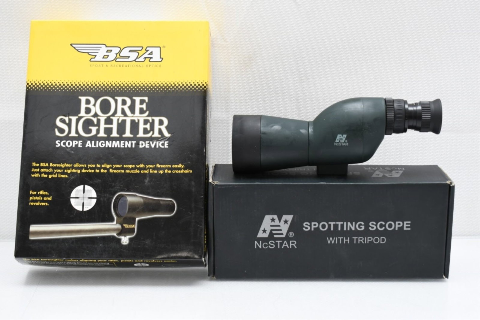 BSA Boresighter & NcStar Spotting Scope: (A) BSA Boresighter - 30mm collimator with 15 studs & hardcase - appears to be complete and in working order. (B) NcStar spotting scope with box, carry case & tripod - appears to be in good working or