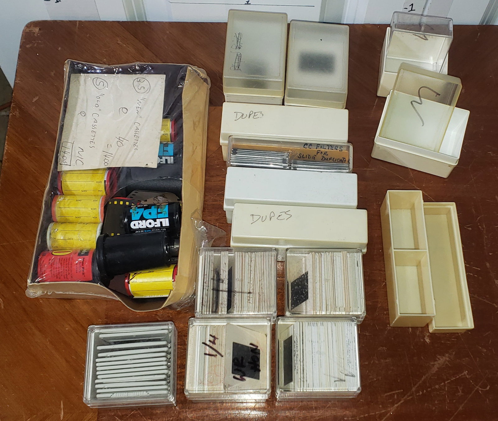 Kodachrome slides & 35mm film rolls: assortment of 35mm film rolls & Kodachrome slides, holder boxes