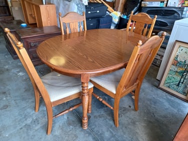 Dining Table and 4 Chairs / All chairs covered in clear plastic