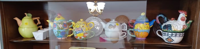 Lot of all teapots on shelf