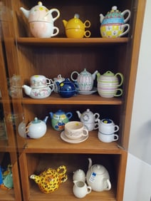 Lot of ALL Teapots seen in Cabinet