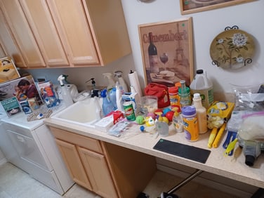 Lot of Laundry items / everything on countertops