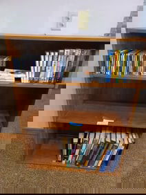 Bookshelf and contents / cd's, dvd's, books