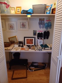 Entire Contents of Closet except white table
