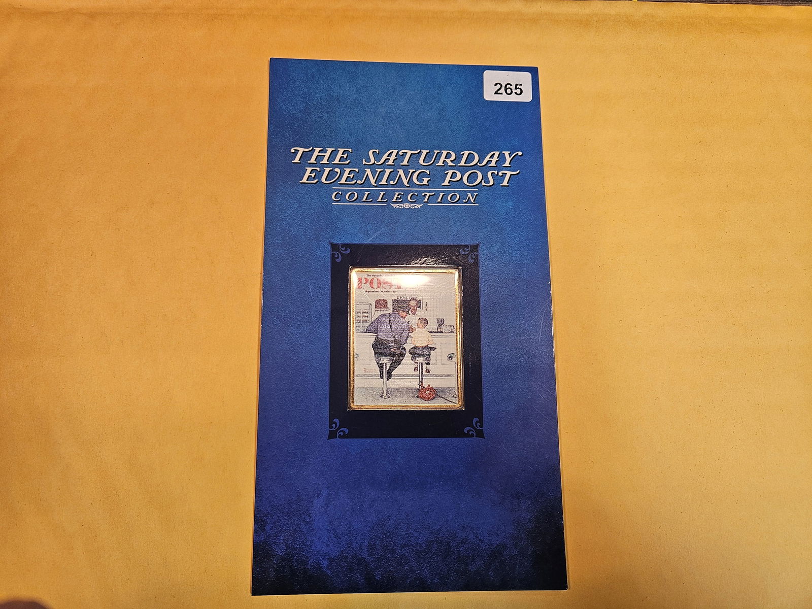 Saturday Evening Post Silver Gold-layered Ingot: Saturday Evening Post One Ounce .999 Silver Layered 24k Gold Colorized Ingot Set. In original packaging. Back on this one is opened