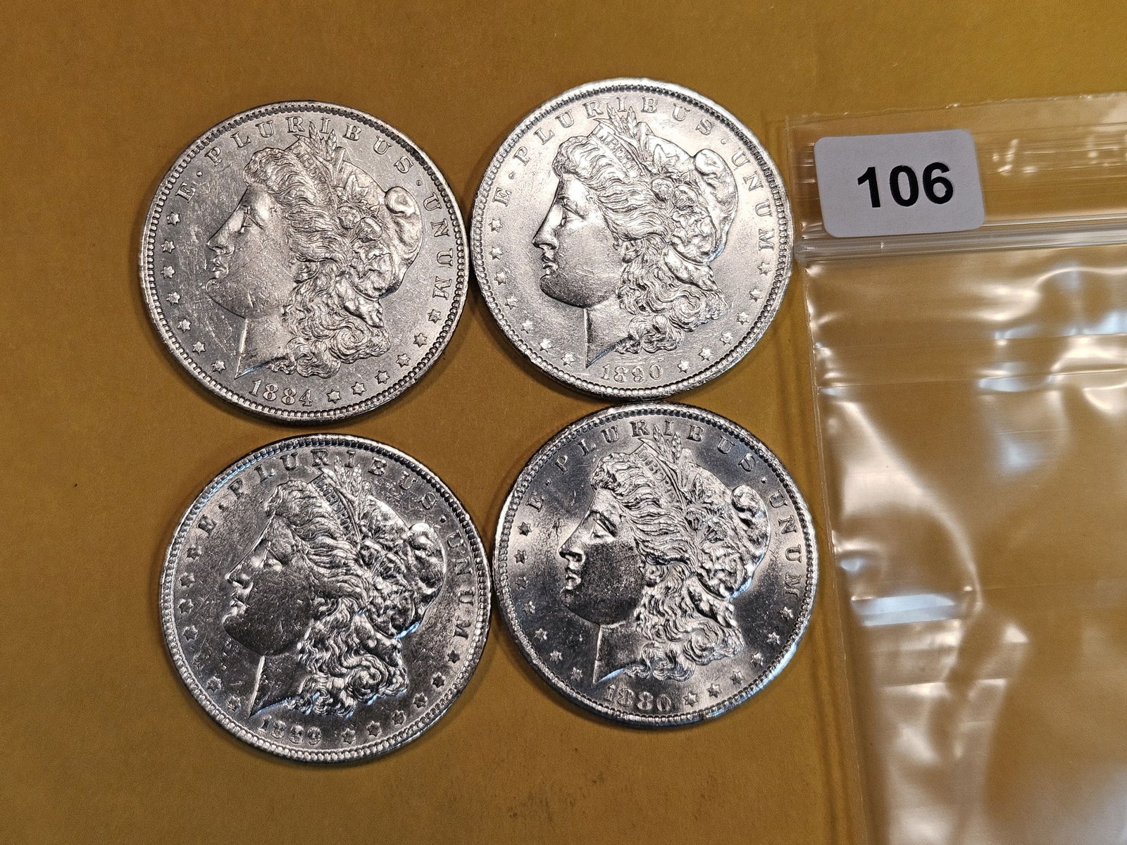 Four mixed Morgan Silver Dollars (1 of 2)