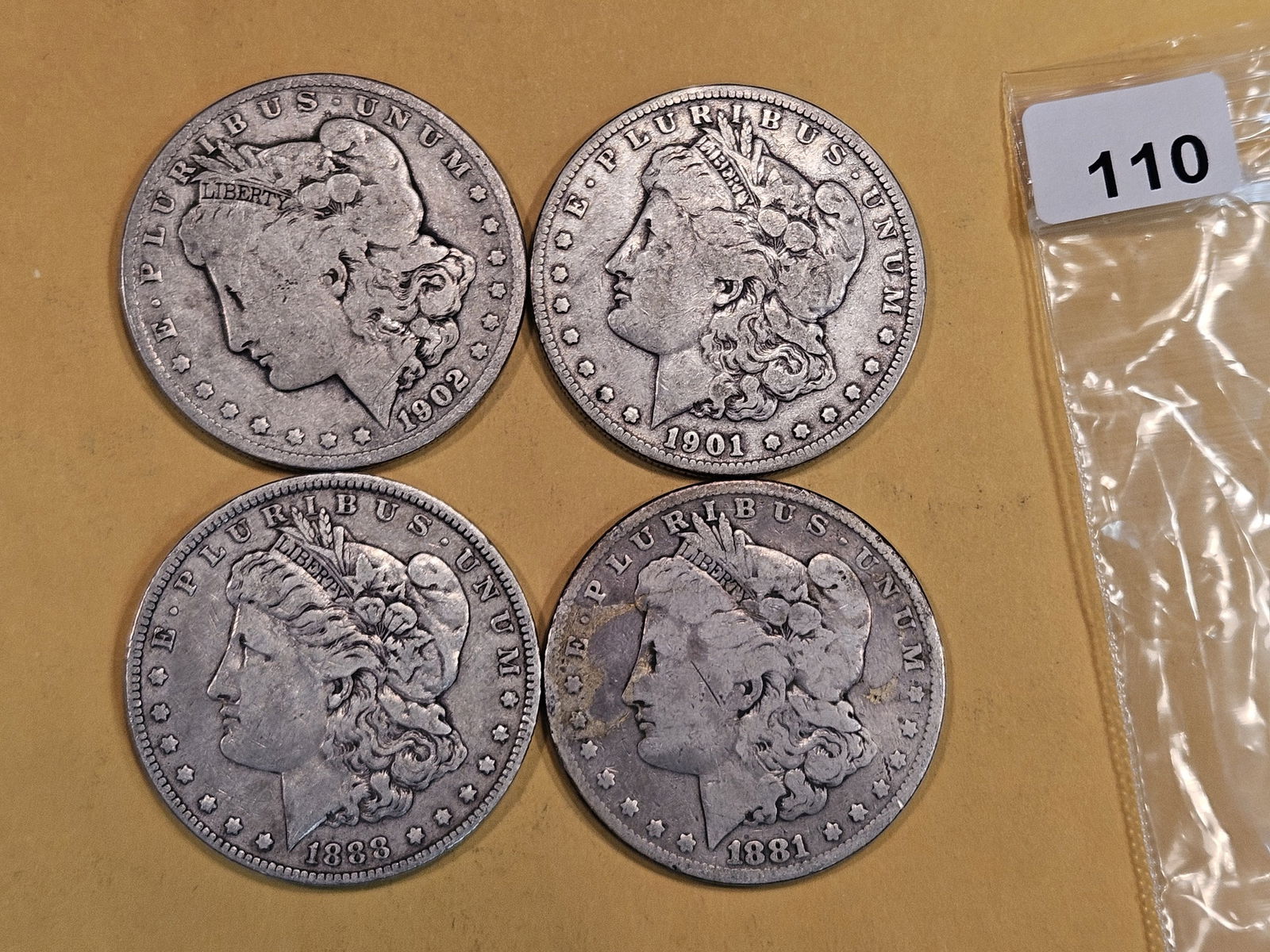 Four Morgan Silver Dollars (1 of 2)