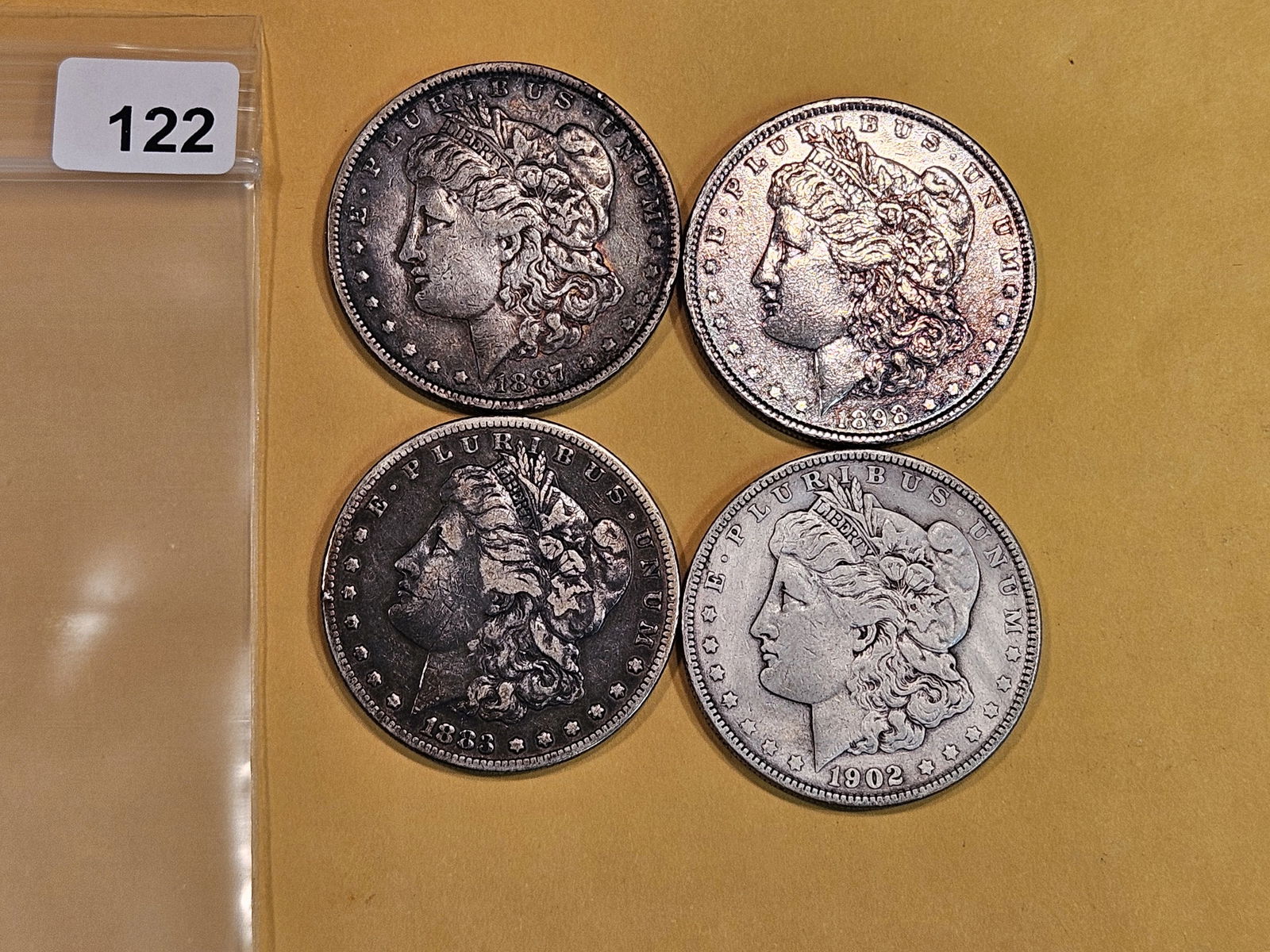 Four Morgan Silver Dollars (1 of 2)