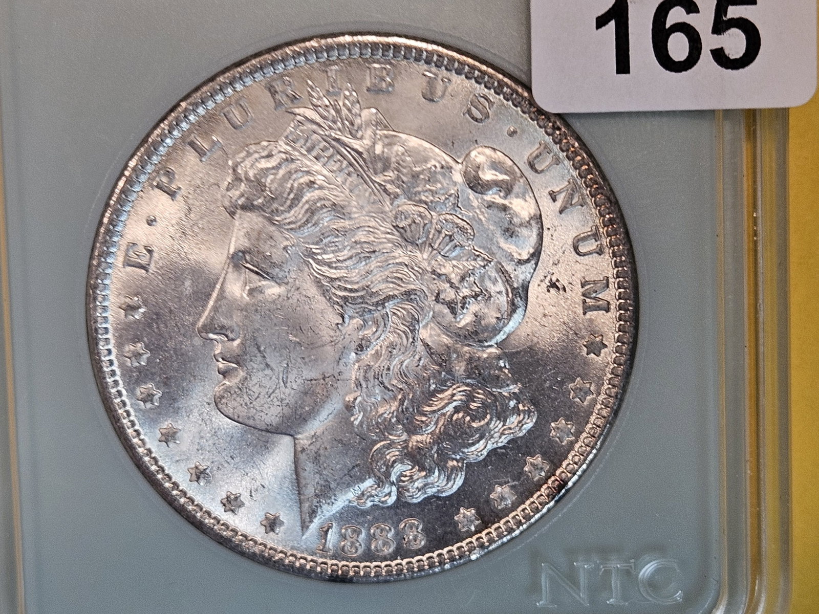 Choice Brilliant uncirculated 1888 Morgan Dollar: Label says 64. Probably not quite that high