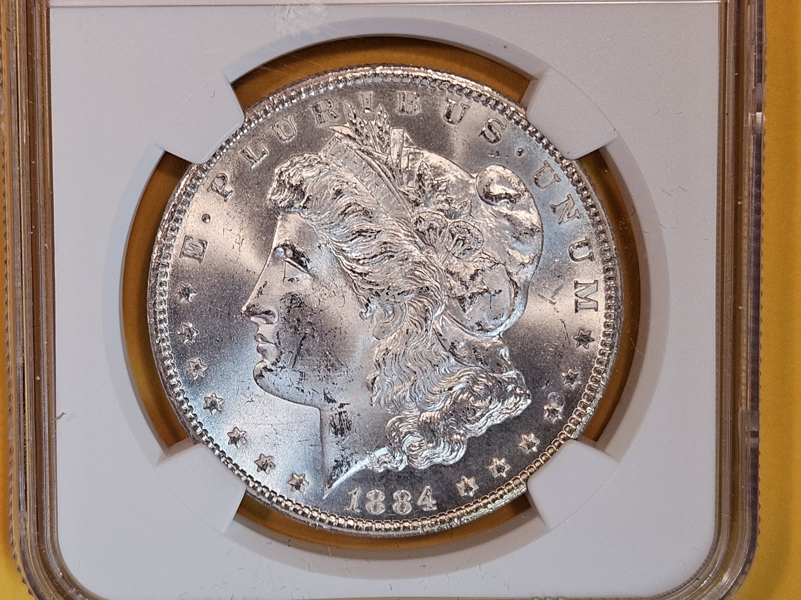 ** KEY DATE ** NGC 1884-CC Morgan Dollar in Mint State 64: KEY DATE! CARSON CITY! Satiny luster and sharp strike