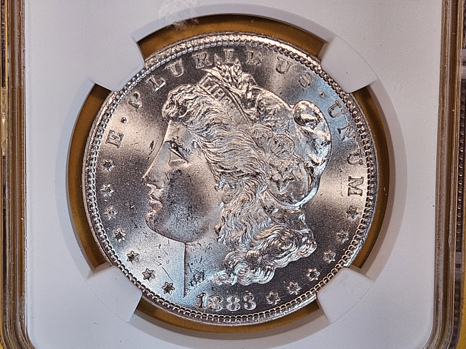 ** KEY DATE ** NGC 1883-CC Morgan Dollar in Mint State 64 (1 of 9)