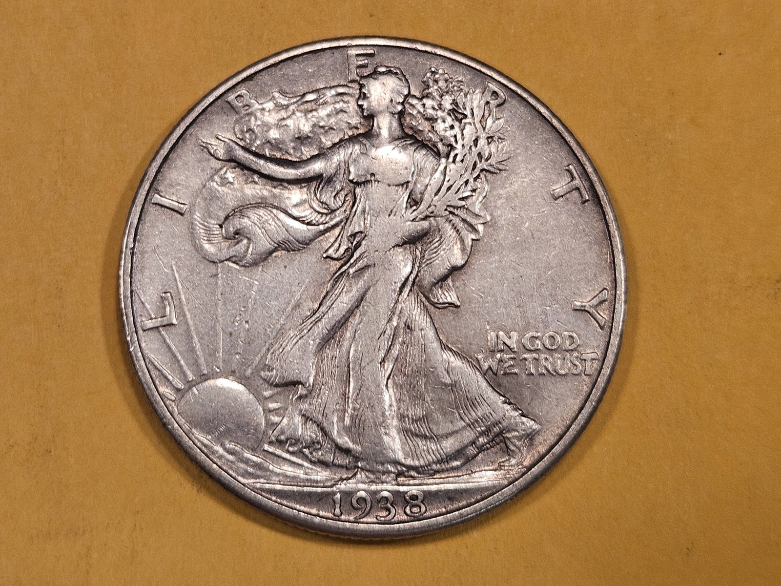 * Key Date 1938-D Walking Liberty Half Dollar in Very Fine plus: Older, light wipe