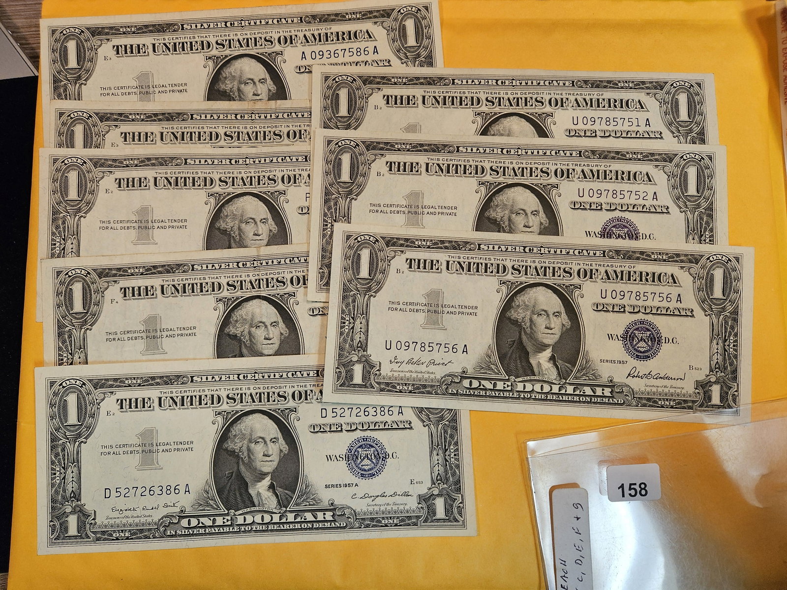 Eight Crisp AU-UNC One dollar silver certificates (1 of 1)