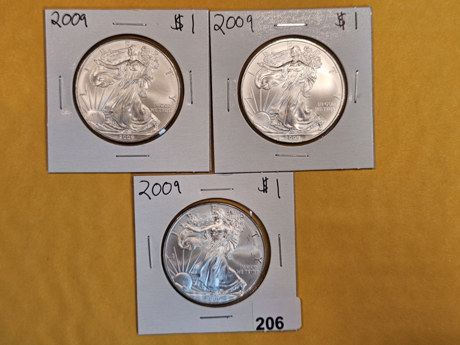 Three GEM BU 2009 American Silver Eagles (1 of 2)