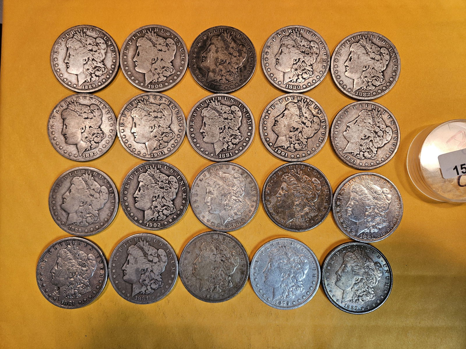 ** FULL ROLL ** Twenty Morgan Silver Dollars: All pre-1904. Grades from Good through Brilliant Uncirculated - details