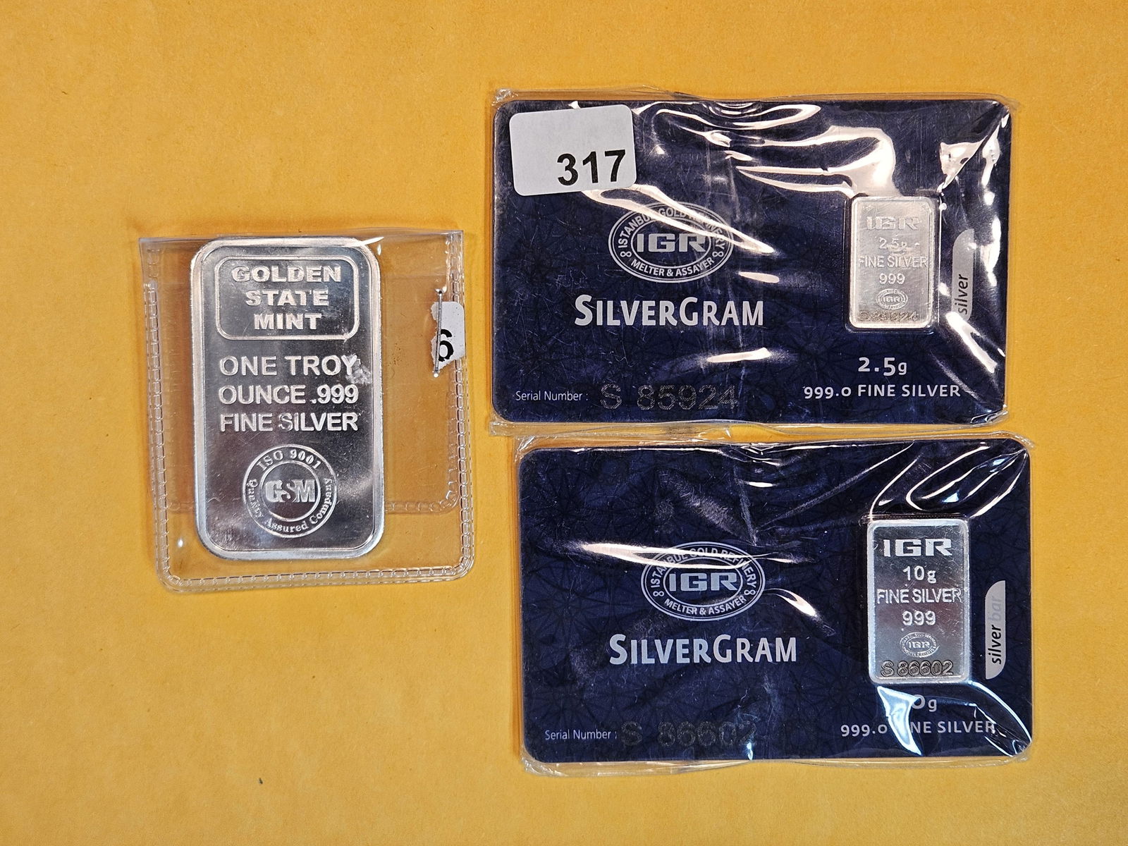Three .999 fine silver bars: Two IGR-assayed bars. 2.5 grams and 10 grams. And a 1 troy ounce bar