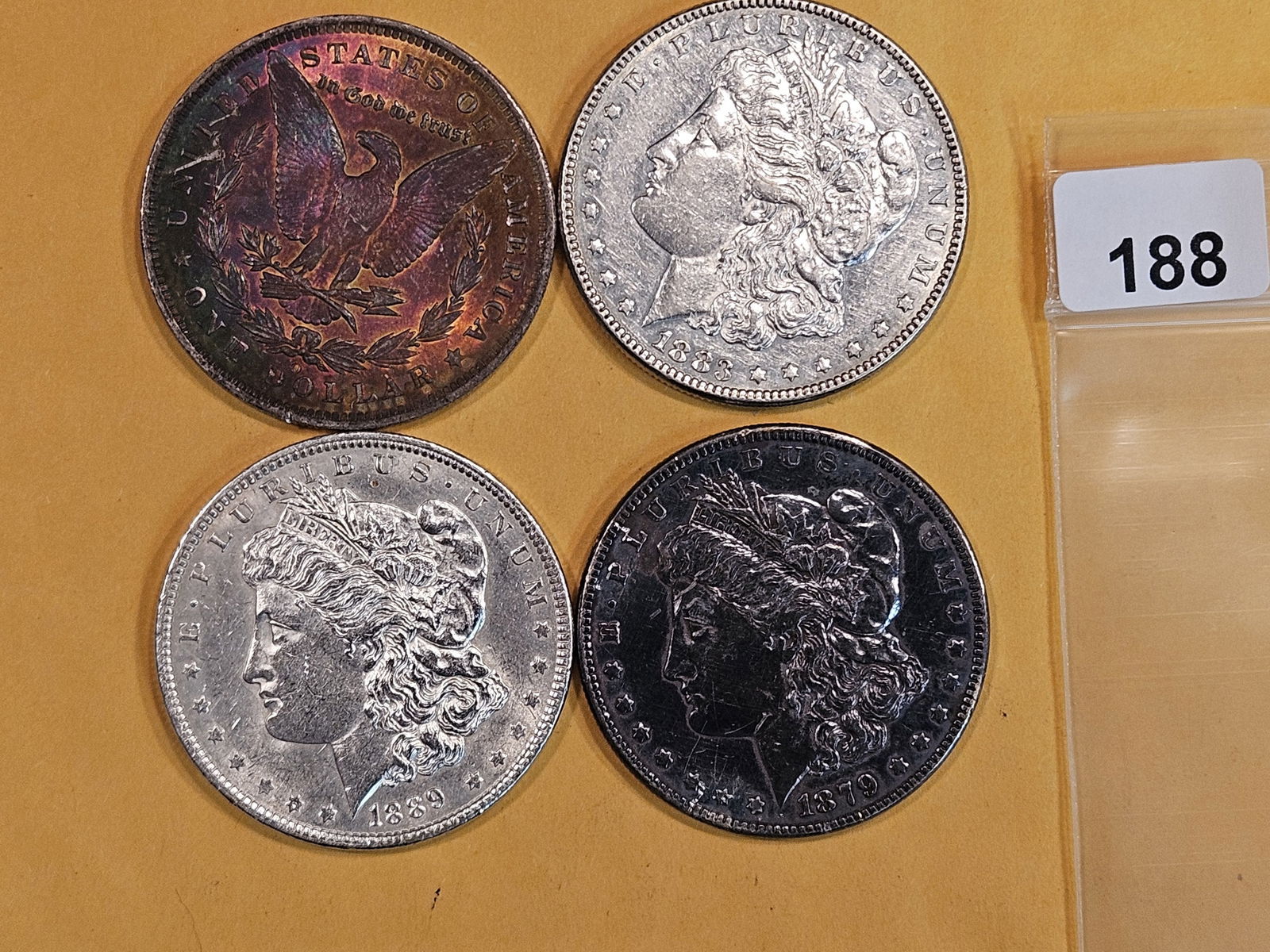 Four mixed Morgan Silver Dollars (1 of 2)
