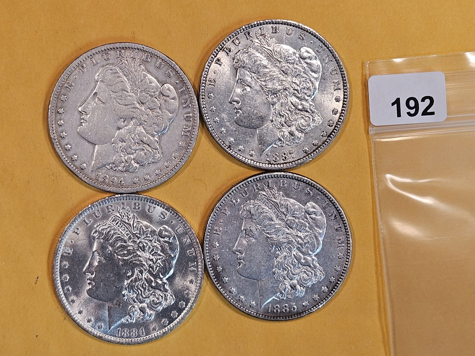 Four mixed Morgan Silver Dollars (1 of 2)
