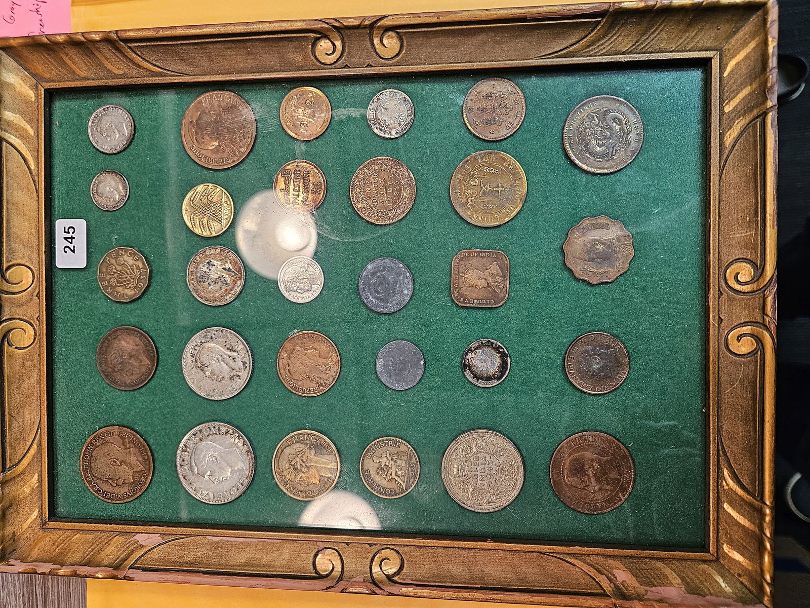 Thirty World coins: Mounted in a display frame