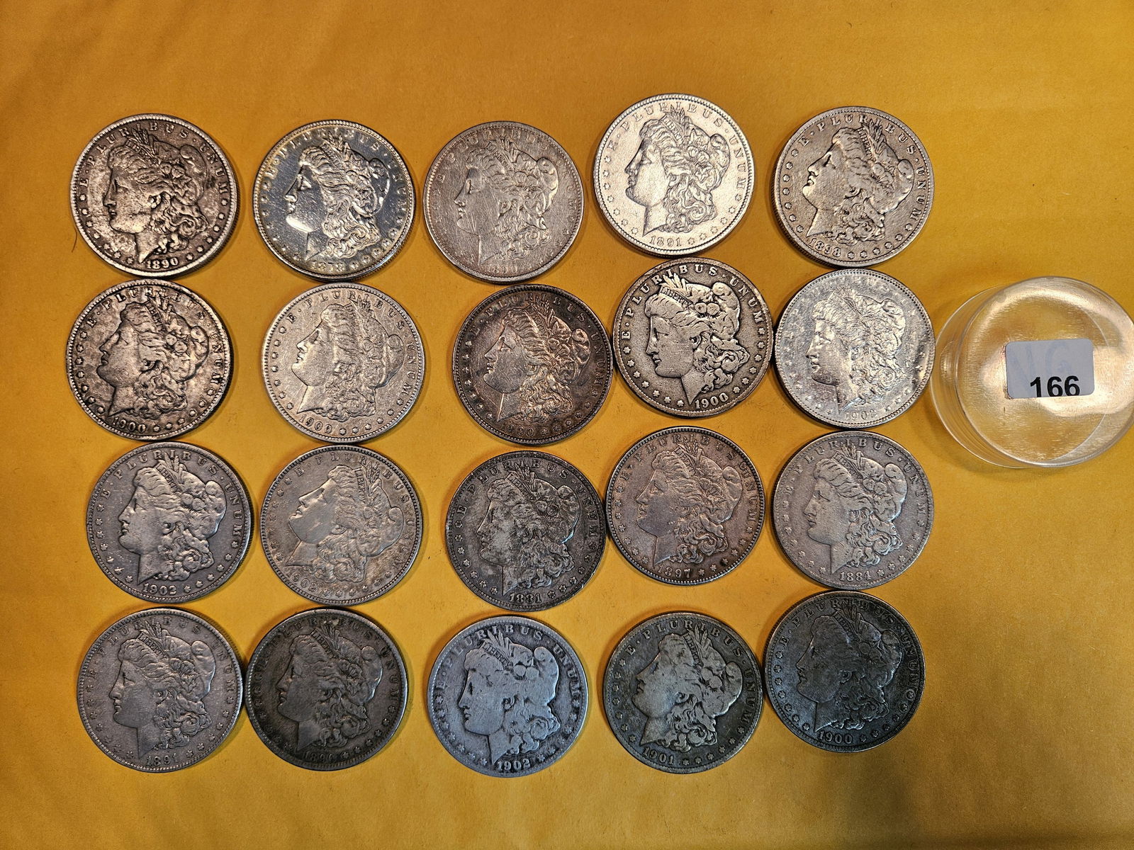 ** FULL ROLL ** Twenty Morgan Silver Dollars: All pre-1904. Grades from Very Good to Choice Brilliant Uncirculated - details