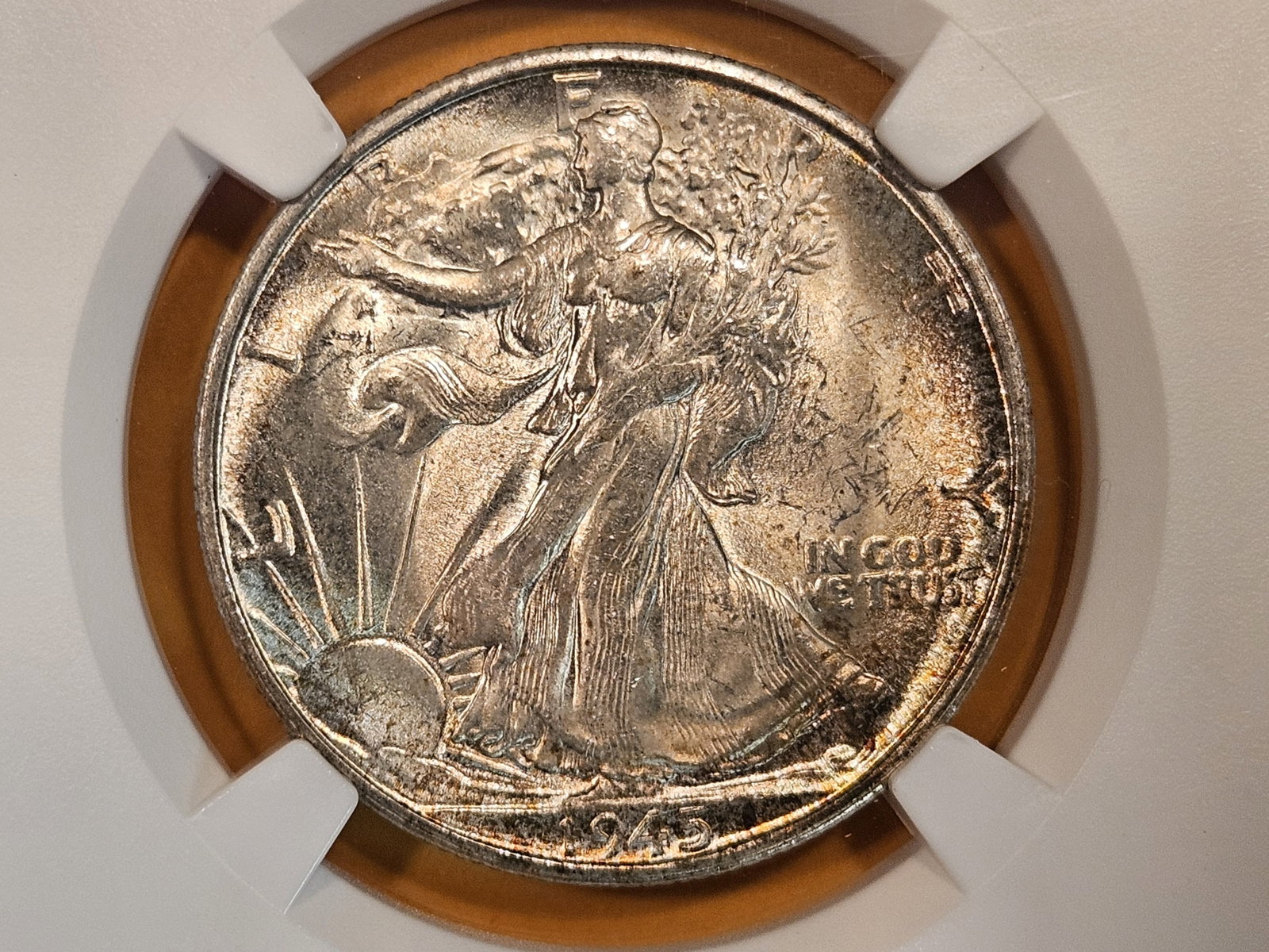 NGC 1945-S Walking Liberty Half Dollar in Mint State 63: Nicely toned