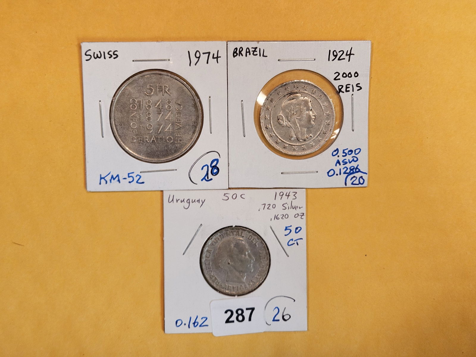Three mixed silver World coins (1 of 4)