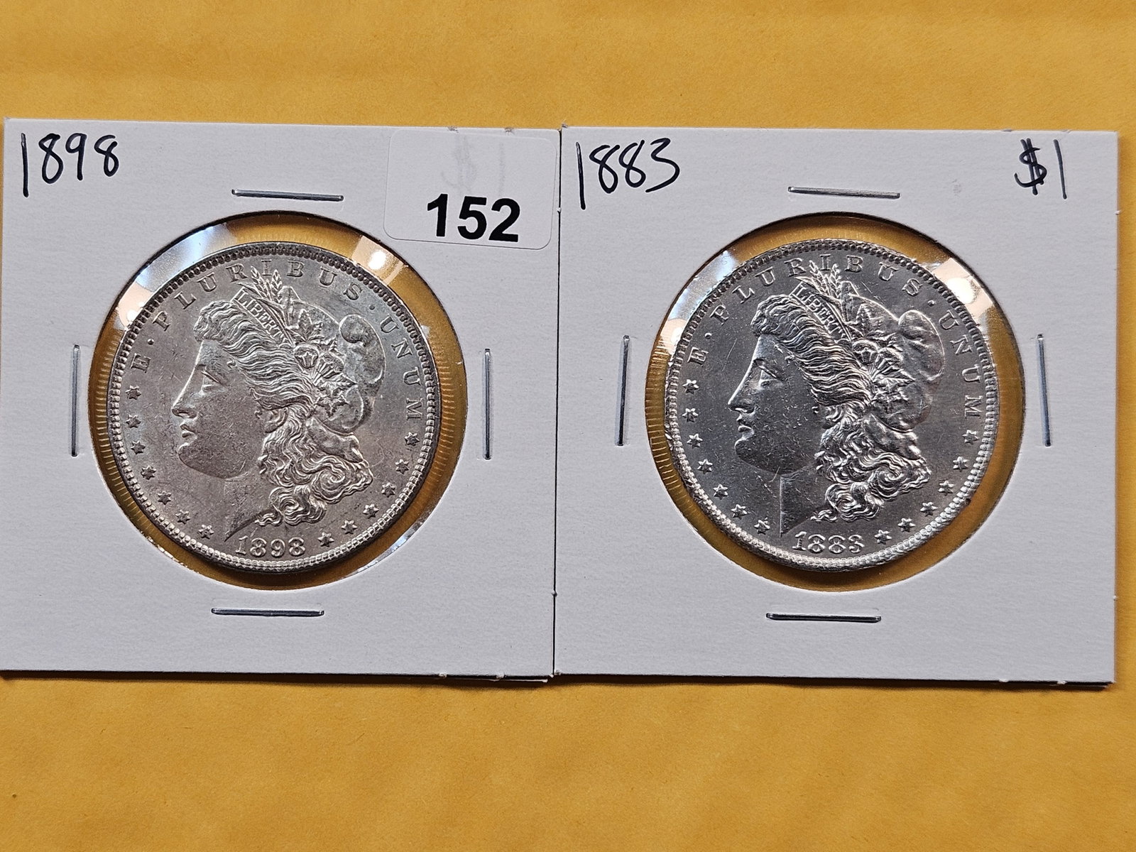 Two Brilliant About Uncirculated plus Morgan Silver Dollars: 1883 and 1898