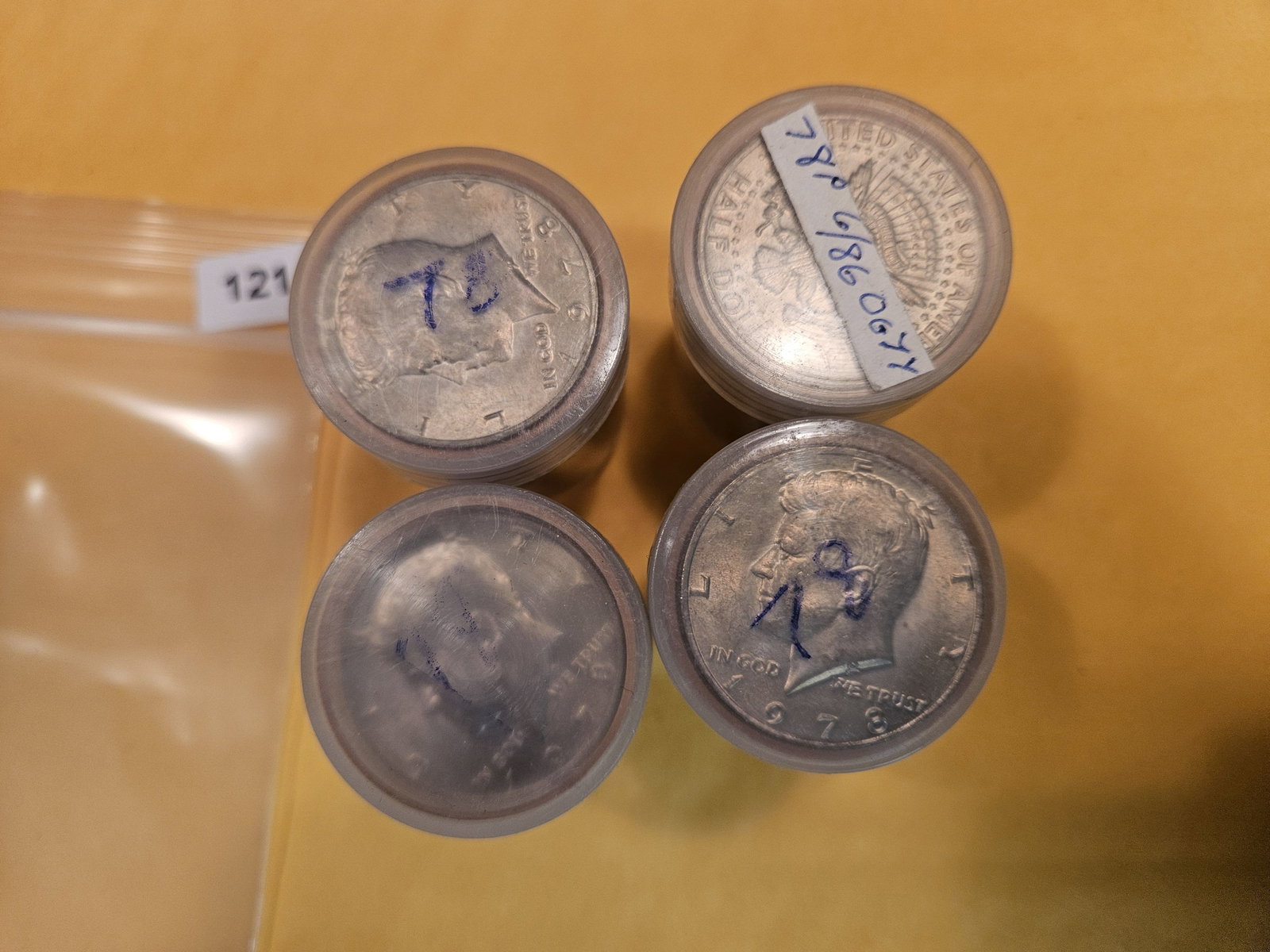 Four rolls of Brilliant Uncirculated Kennedy Half Dollars (1 of 2)