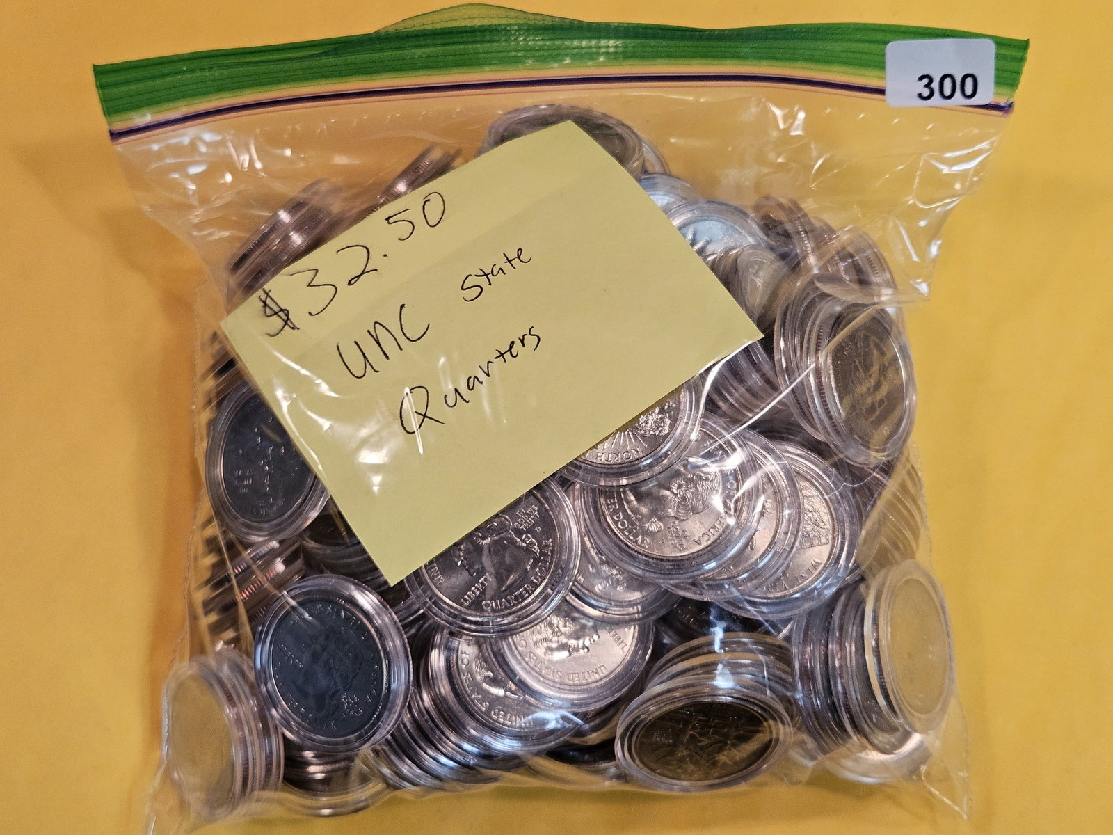 Big Bag of Brilliant Uncirculated Washington Statehood Quarters: Most, or all, in plastic capsules. There is $32.50 face value in there