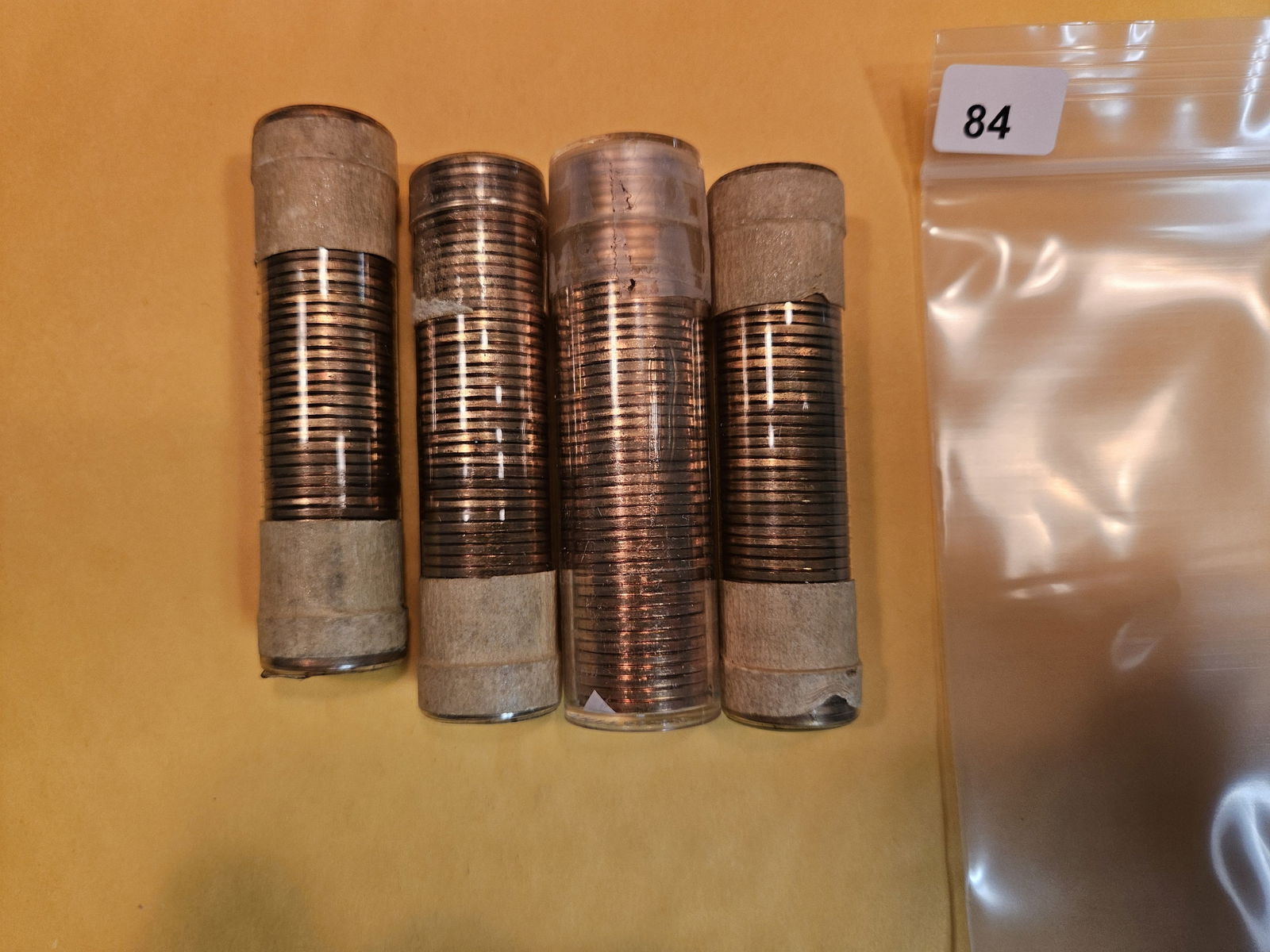 Four Brilliant Uncirculated red rolls of 1957-D Wheat cents (1 of 2)
