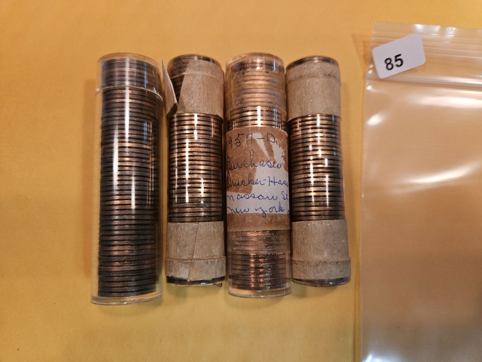 Four Brilliant Uncirculated red rolls of 1957-D Wheat cents (1 of 2)