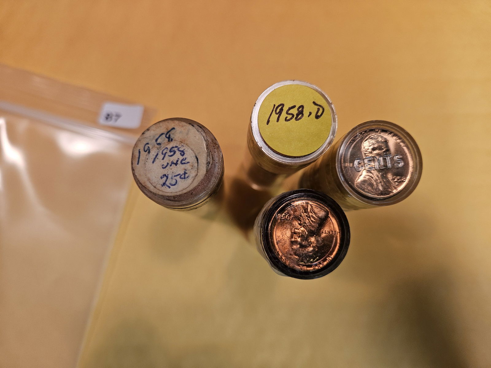 Four Brilliant Uncirculated red rolls of 1958 and 1958-D Wheat cents (1 of 2)