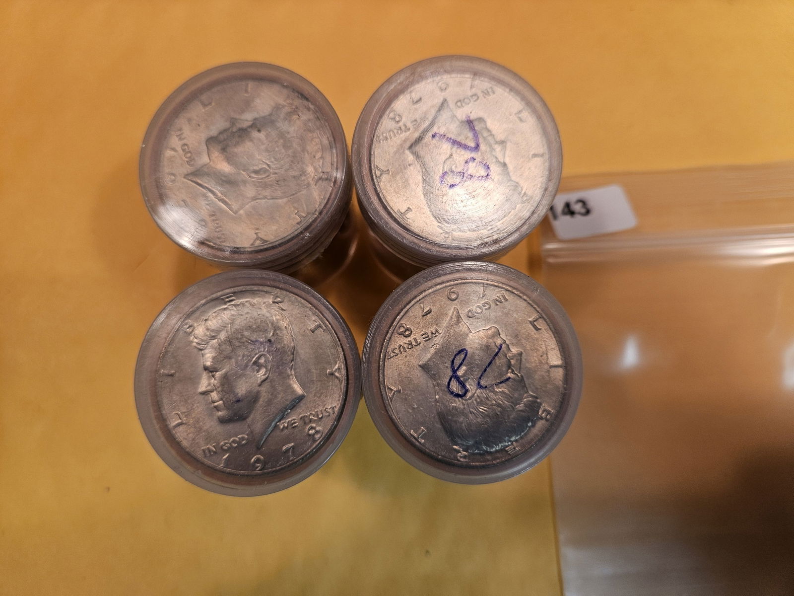 Four Brilliant Uncirculated rolls of Kennedy half Dollars (1 of 2)