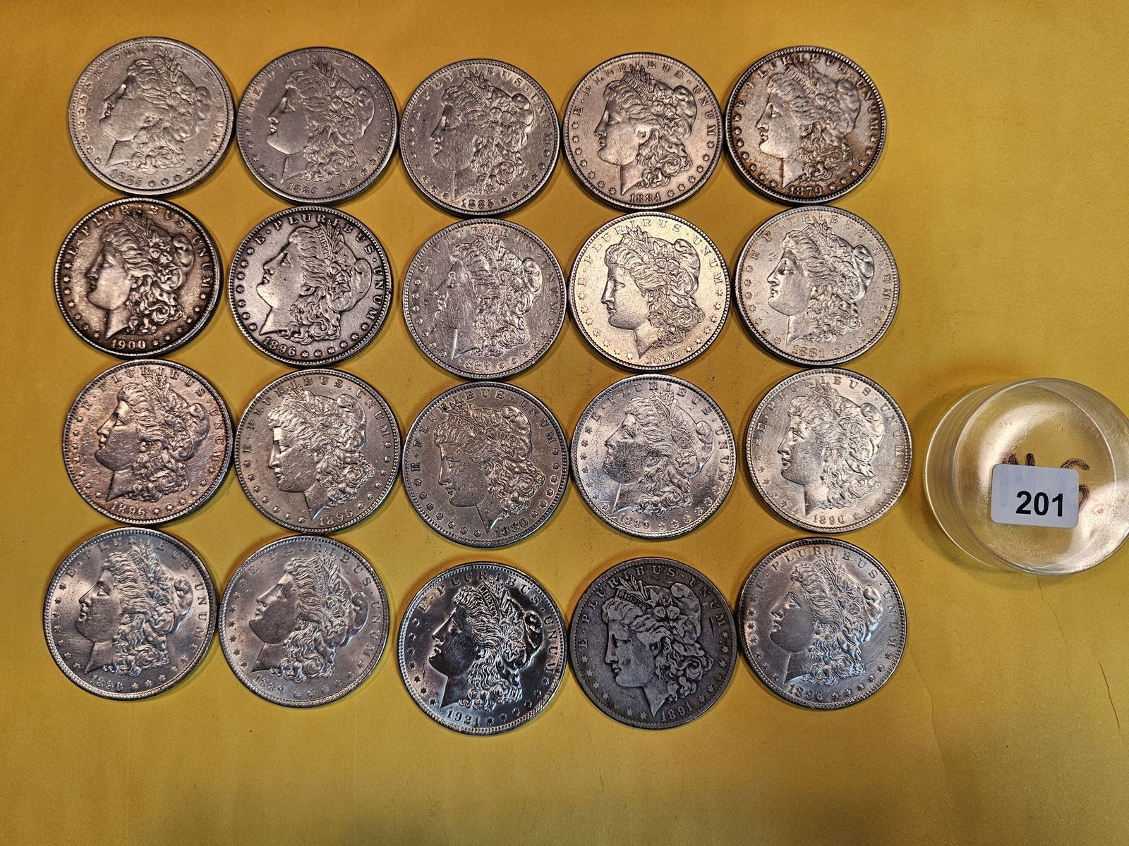 ** FULL ROLL ** Twenty Morgan Silver Dollars: All pre-1904. Grades from Very Good to Choice Brilliant Uncirculated - details